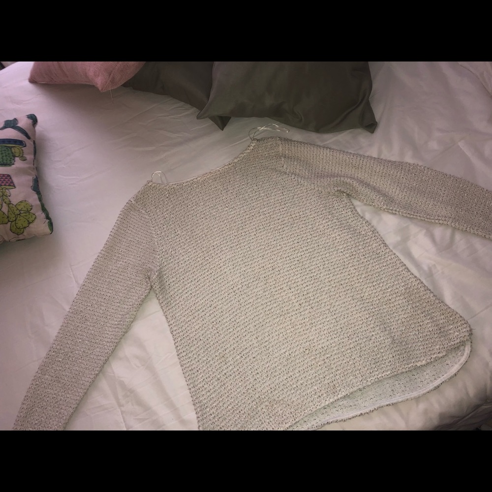 White and black speckled sweater